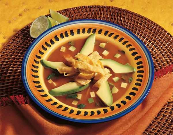 Tortilla Soup garnished with avocado. Pictures, Images and Photos